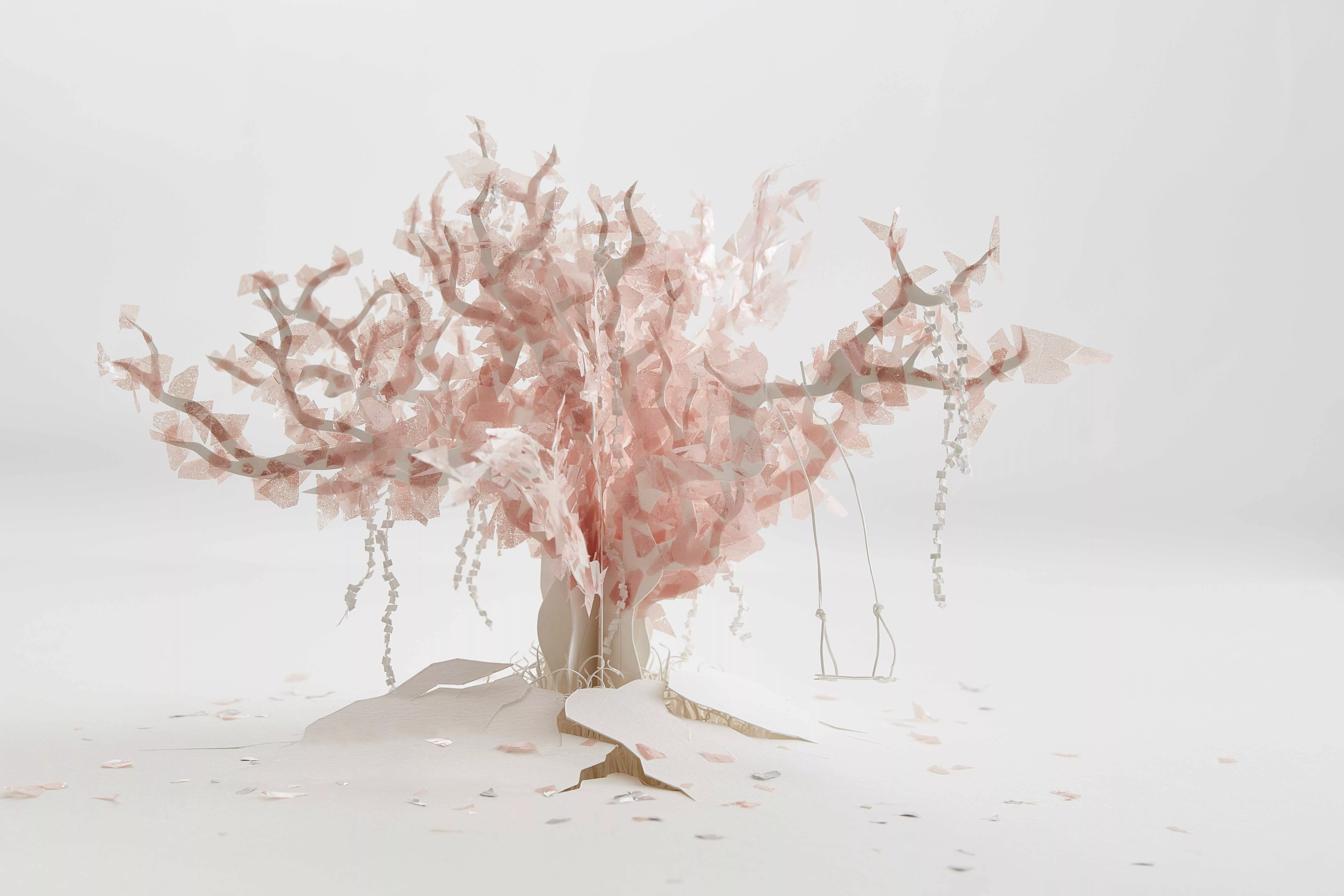 Sculpture en papier de l'artiste Marie Gobert : arbre blanc habillé de pétales rose.