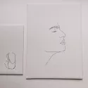 deux dessins brodés sur toile tendue
